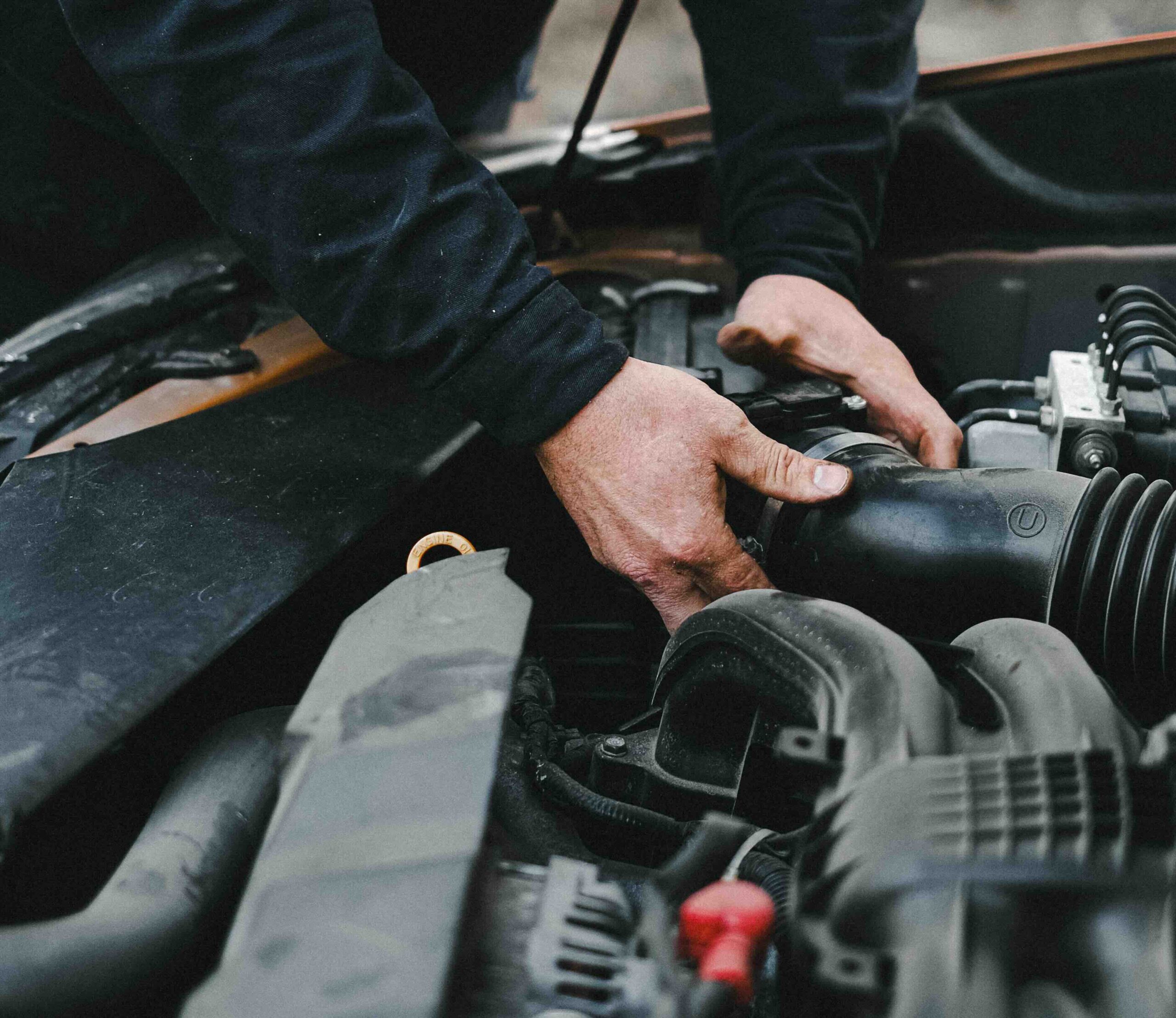 Vehicle maintenance Mechanic performing engine repair and maintenance on equipment for Nemaha Sports Construction.
