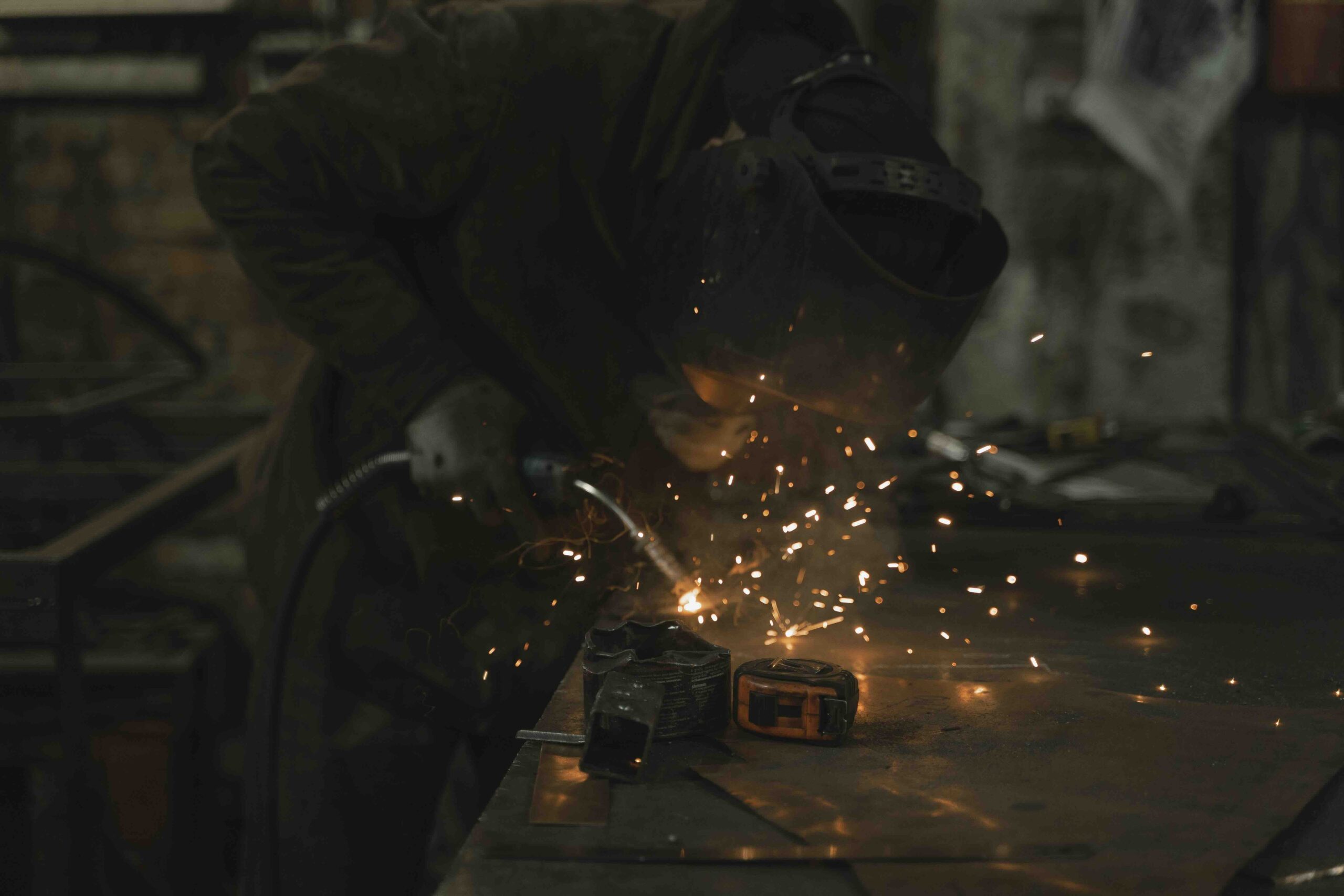 Welding stock image Welder fabricating metal equipment as a featured image for Nemaha Sports Construction's new shop mechanic position.